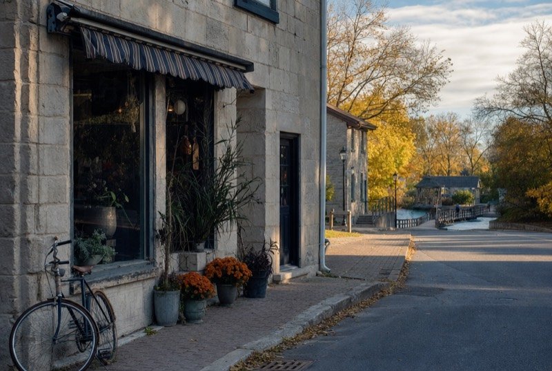 Old stone building on a corner, home to an independent shop